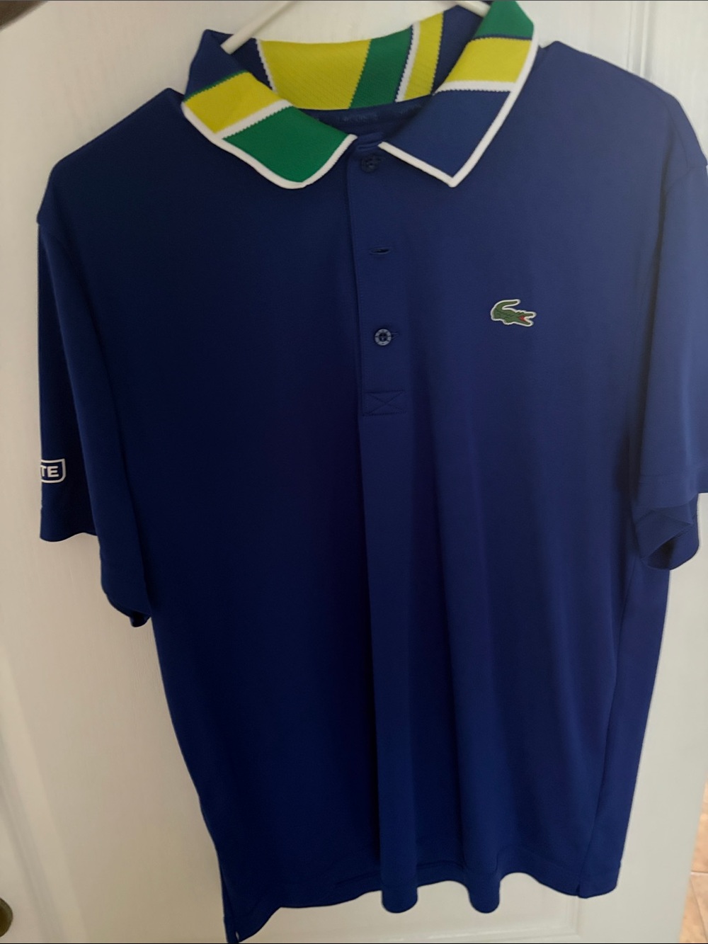 Lacoste Men's Navy Polo with Green & Yellow Striped Collar